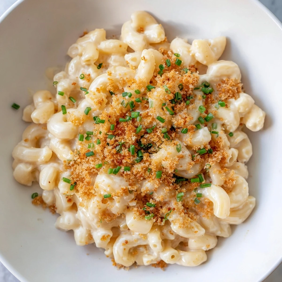 A close-up shot of the rich, golden Mac and Cheese on the stovetop, perfect for a hearty meal.