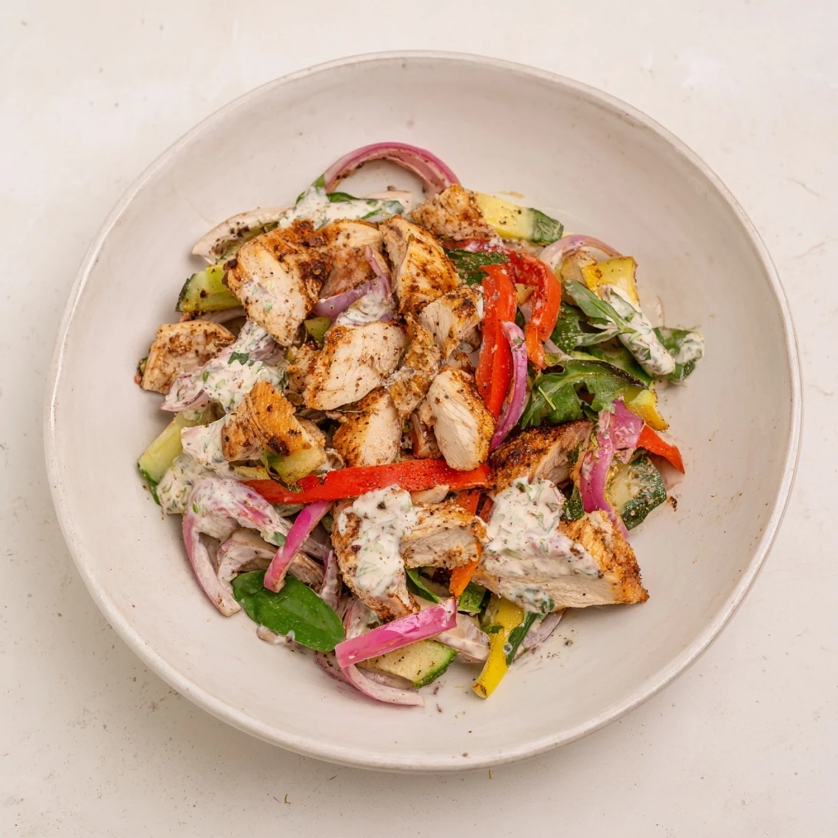 Flavorful Mrs. Dash-infused canned chicken salad, served chilled on a bed of fresh greens.