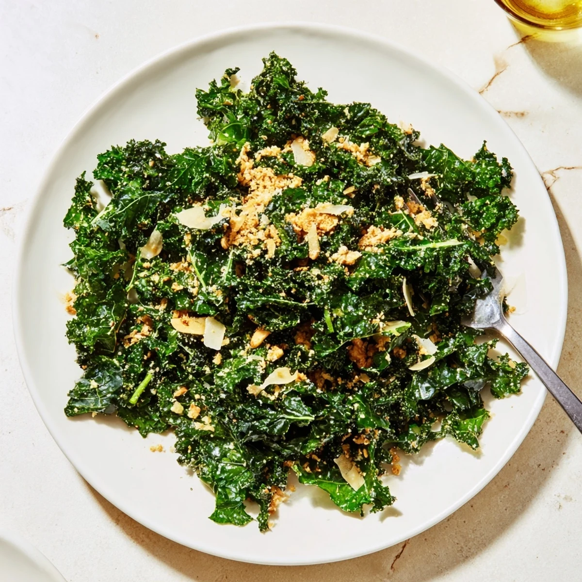 A vibrant Garlic Parmesan Kale Salad served as a hearty side or light lunch.  