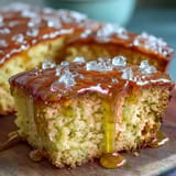 A golden Lemon Drizzle Loaf Cake with a glossy lemon glaze and a moist, tender crumb.