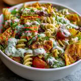 Creamy avocado ranch coats rotini pasta, black beans, corn, and fresh vegetables in this Tex-Mex inspired salad.  