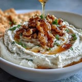 Velvety whipped feta dip topped with golden honey, perfect for serving with pita.