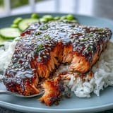 This salmon teriyaki bowl showcases perfectly cooked salmon with vibrant healthy accompaniments.