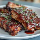 Tender Father's Day BBQ Rib Board with classic, spicy, and maple sauces.