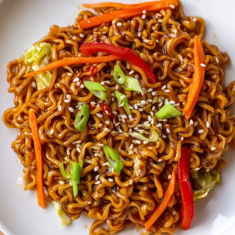 A close-up of the flavorful Spicy Ramen Stir Fry, a quick vegetarian meal ready to eat.