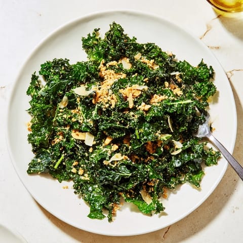 A vibrant Garlic Parmesan Kale Salad served as a hearty side or light lunch.  