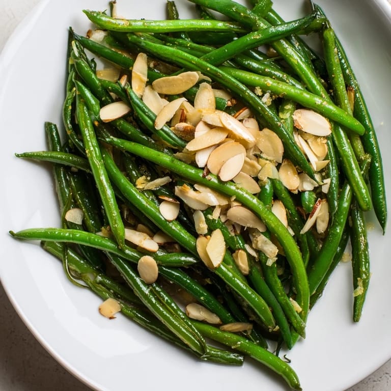 Golden toasted almonds and garlic elevate these sauteed green beans to a perfect side, ready to eat.