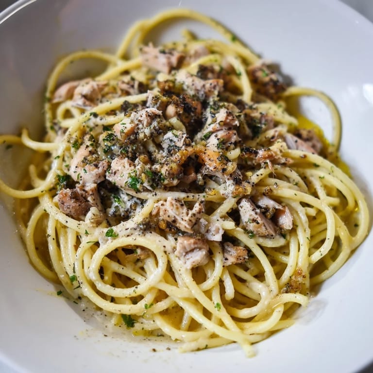 Golden Simple Garlic Butter Bucatini, tossed with flavorful garlic butter and shredded chicken, ready to eat.