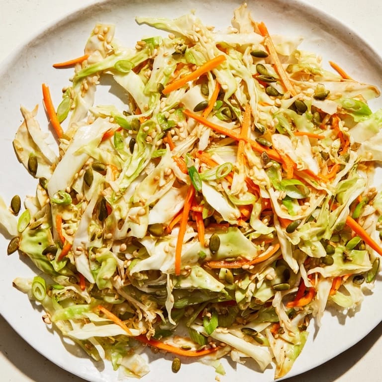 Delicious and crunchy Cabbage-Core Slaw Salad, featuring a sesame dressing, ready for a vegan meal.