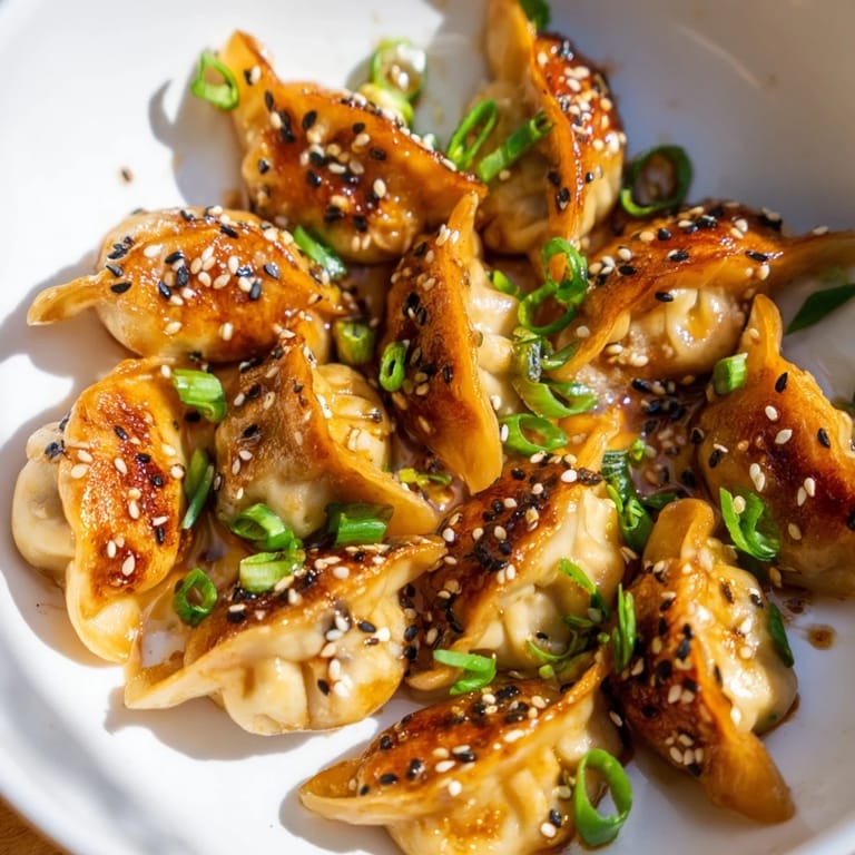 Savory and perfectly cooked Air Fryer Frozen Dumplings, brushed with glaze for an irresistibly crispy exterior.