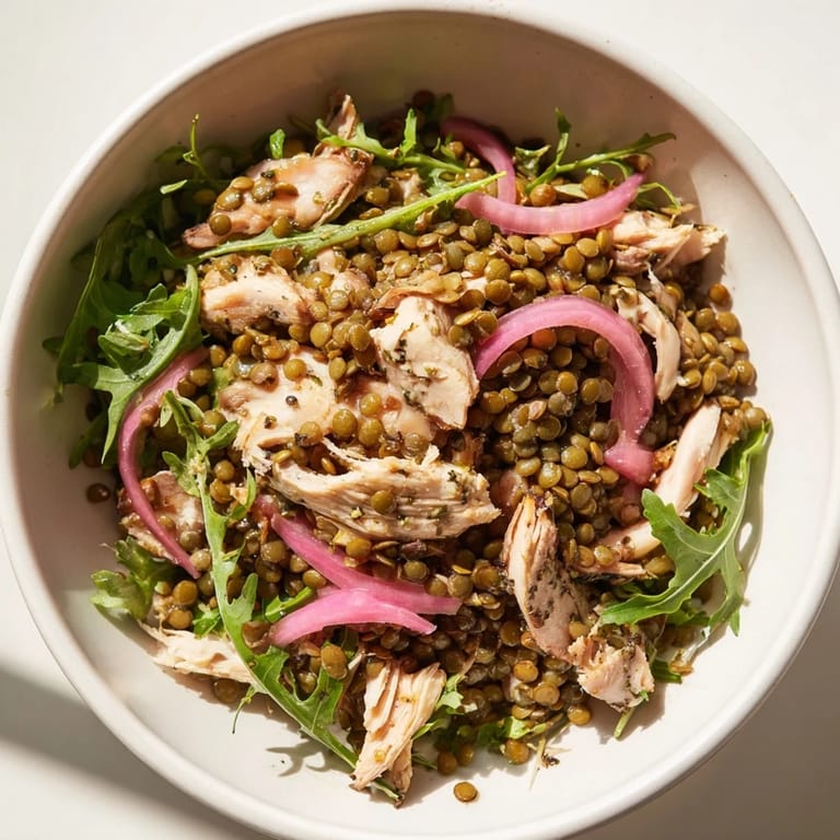 Hearty Lentil & Chicken Spring Salad tossed with crisp greens and pickled onions, perfect for a protein-packed light dinner or meal prep.