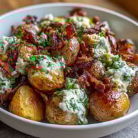 Creamy BBQ baby shower loaded baked potato salad with crispy bacon and melted cheddar in a tangy BBQ dressing.  