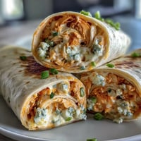 Buffalo Chicken Cream Cheese Pinwheel Wraps with creamy Buffalo sauce and shredded chicken in soft tortillas, perfect for parties.